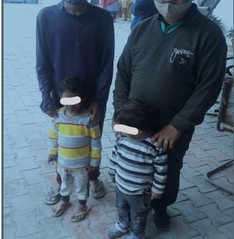 The two kids with their parents after Chhawla Police personnel recovered them
